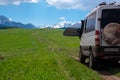 4x4 offroad van Mersedes-benz Sprinter on mountain valley. Off-road travel, journey in motorhome concept