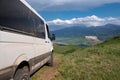 4x4 offroad van Mersedes-benz Sprinter on mountain valley. Off-road travel, journey in motorhome concept