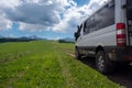 4x4 offroad van Mersedes-benz Sprinter on mountain valley. Off-road travel, journey in motorhome concept