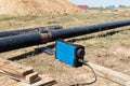 X-ray inspection of the pipeline before the descent into the trench in the field under Royalty Free Stock Photo