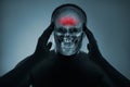 X-ray of a man& x27;s head. Medical examination of head injuries. Frontal part of the brain is highlighted by red colour.