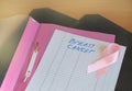 X-rays, two pink ribbons and a pink file folder lie on the table as a symbol of breast cancer awareness and prevention Royalty Free Stock Photo