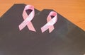 X-rays and two pink ribbons lie on the table as a symbol of breast cancer awareness and prevention Royalty Free Stock Photo