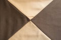 X-shaped seams between beige and brown fabrics