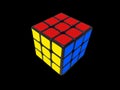 3x3 solved Rubik's Cube on the black background.