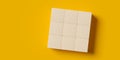 3x3 square array of empty, blank wood blocks or cubes on yellow background, business concept template with copy space, flat lay Royalty Free Stock Photo