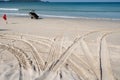 4x4 tyre tracks crisscrossing Tire tracks on the sand texture background in summer day on the beach sand texture Royalty Free Stock Photo