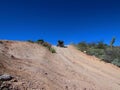 4x4 Vehicle Driving on Steep Dirt Road in Arizona Royalty Free Stock Photo