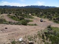 4x4 Vehicle Driving on Steep Dirt Road in Arizona Royalty Free Stock Photo