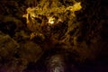 Dim light in the middle of Xerri`s Grotto deeply underground
