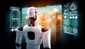 XAI Humanoid AI robot looking at hologram screen showing concept of big data Royalty Free Stock Photo