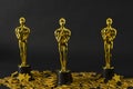 Plastic Oscar awards and golden stars confetti