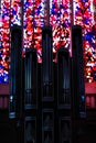 View on organ pipes against colorful bright mosaic windows inside church St. Viktor Dom Royalty Free Stock Photo