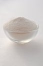 Xanthan gum - a white powder for gluten free baking and cooking, closeup on white background