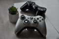 Xbox 360 controller in front with Playstation 3 controller in background Royalty Free Stock Photo