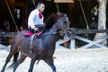 Xcaret, Mexico, December 20, 2022 - Mexican equestrian with a magnificent exhibition of a running lasso changing position.