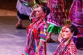 Xcaret, Mexico - January 27, 2023: Beautiful women performing the folkloric dance of the pineapple flower at Xcaret park.