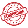 XENOPHOBIA text on red grungy round rubber stamp