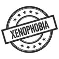 XENOPHOBIA text written on black vintage round stamp