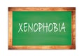 XENOPHOBIA text written on green school board