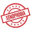 XENOPHOBIA text written on red vintage round stamp