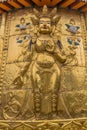 XIAHE, CHINA - AUGUST 25, 2018: Golden Buddha relief at Gongtang pagoda at Labrang monastery in Xiahe town, Gansu