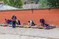 XIAHE, CHINA - AUGUST 25, 2018: Tibetan Buddhist devotees pray in front of Gongtang pagoda at Labrang monastery in Xiahe