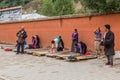 XIAHE, CHINA - AUGUST 25, 2018: Tibetan Buddhist devotees pray in front of Gongtang pagoda at Labrang monastery in Xiahe