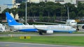 Xiamen Air Boeing 737 taxiing at Changi Airport Royalty Free Stock Photo