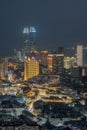 Xiamen city skyline with modern buildings, twin towers, old town and sea at dusk