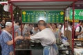 People buying food in a food stall at a street market at the Muslim Quarter in the city of Xian in China Royalty Free Stock Photo