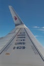 Wing of an Airbus A321 Airplane of China Eastern Airlines with sky background