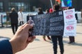 Xian, China - December 29, 2019: Asian hand holding entrance ticket in front of the entrance terracotta warriors at the museum