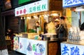 Xian, China - December 29, 2019: Street food night market with crowed pedestrain street in the Muslim Quarter at Xi`an China Royalty Free Stock Photo