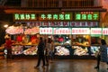 Xian, China - December 29, 2019: Street food night market with crowed pedestrain street in the Muslim Quarter at Xian China