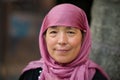 Xian, Shaanxi, China - 08 11 2016: Mature Muslim Hui Chinese woman wearing hijab and smiling