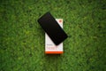 Xiaomi Redmi Note 7 smartphone on green leaves background