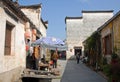 Xidi Ancient Town in Anhui Province, China. An old man is shopping at a street stall