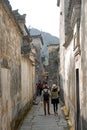 Xidi Ancient Town in Anhui Province, China. Two tourists explore the old town.