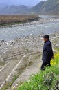 Xin Xing Zhen, China: Man Gazing at River Royalty Free Stock Photo