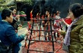 Xindu, China: People Lighting Incense Sticks