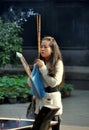 Xindu, China: Woman Praying with Incense Sticks