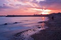 Xinghai Beacht at red colored sunset reflected in the sea, Dalian, China