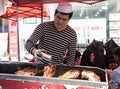 Xinjiang food vendor cooking lamb.