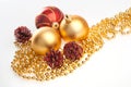 Xmas balls and cones on golden beads Royalty Free Stock Photo