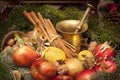 Xmas basket with apple, vlanuts, needles and mortar Royalty Free Stock Photo
