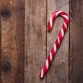Xmas candy cane on wooden background Royalty Free Stock Photo
