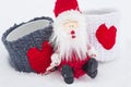 Xmas concept. Santa Claus sits on the snow with two love mugs. C Royalty Free Stock Photo