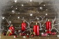 Xmas decoration on wooden rustic background: four red burning ad Royalty Free Stock Photo