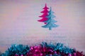 Colorful christmas photography image of christmas decoration hanging up of xmas trees in pink blue glitter and tinsel Royalty Free Stock Photo